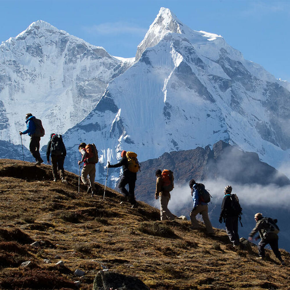 Sky,Mountain,People in nature,Snow,Slope,Highland,Outdoor recreation,Travel,Glacial landform,Hiking equipment