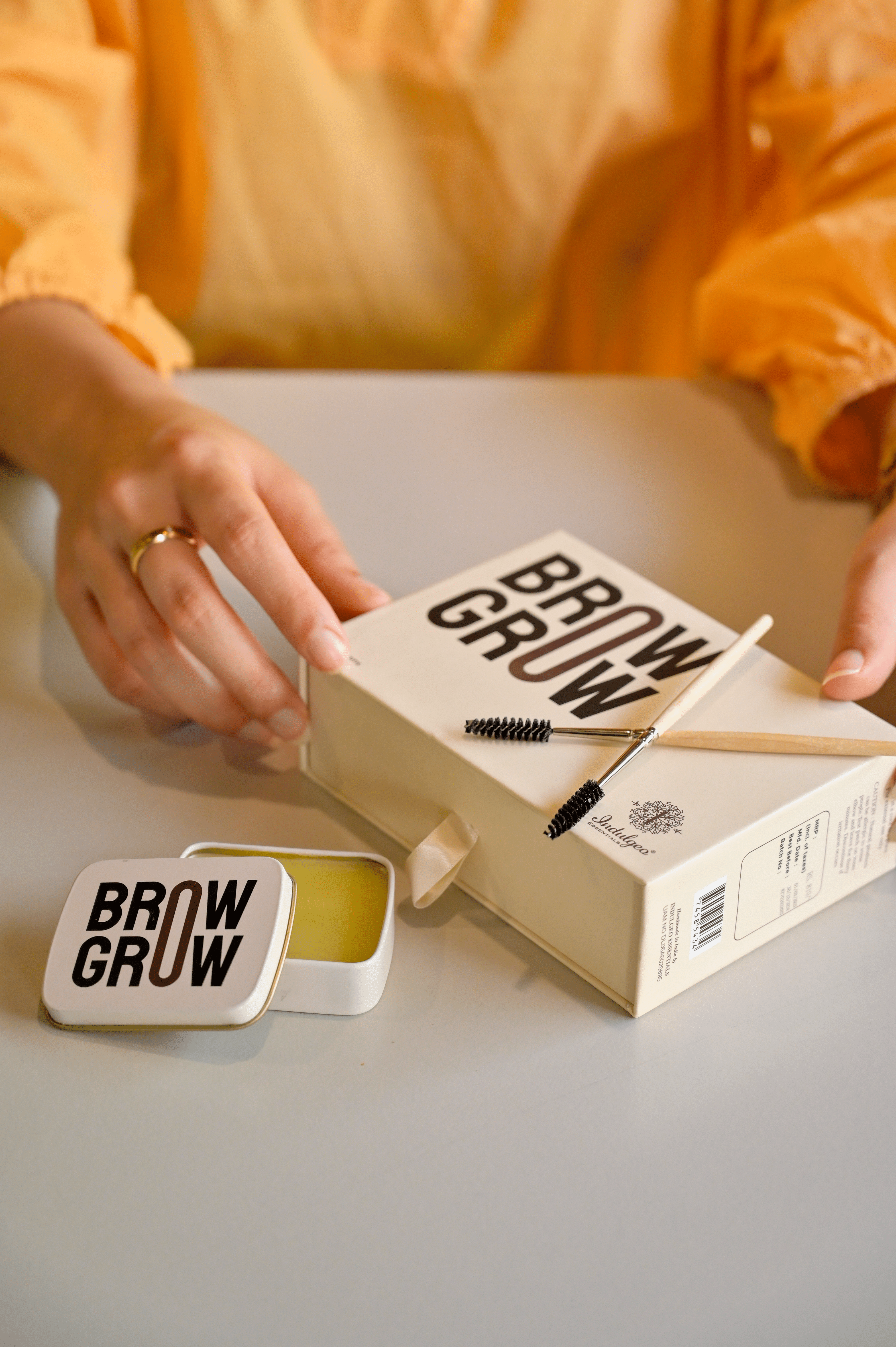 Hand,Product,Orange,Finger,Font,Wood,Nail,Brand,Table,Thumb