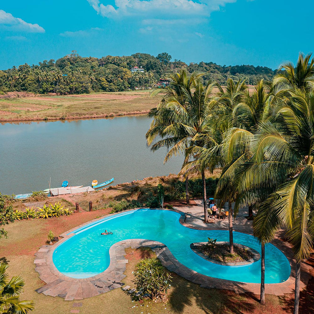 Water,Sky,Cloud,Plant,Property,Azure,Nature,Tree,Swimming pool,Natural landscape