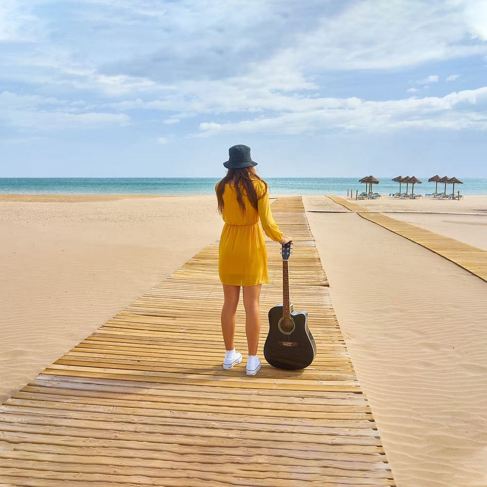 Sky,Cloud,Water,Shorts,Beach,Travel,People in nature,Wood,Leisure,Fun