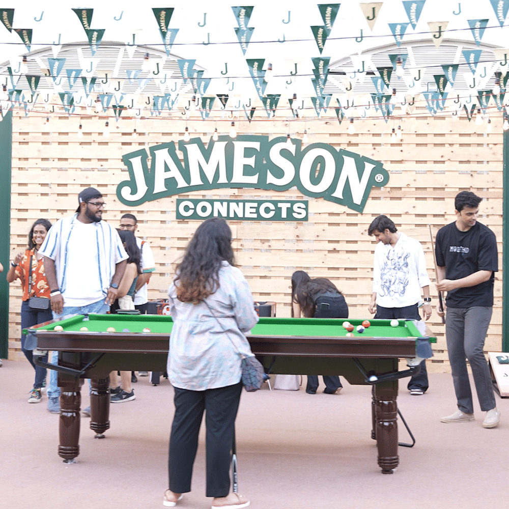 Clothing,Trousers,Sports equipment,Billiard table,Table,Green,Billiards,Musical instrument,Pool player,Cue stick