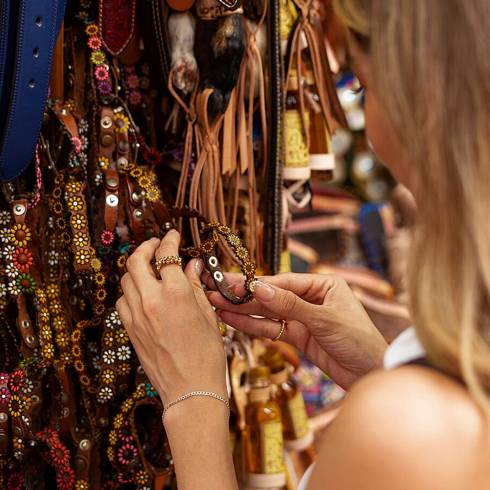 Hand,Temple,Sleeve,Fashion design,Nail,Pattern,Jewellery,Event,Human settlement,Tradition