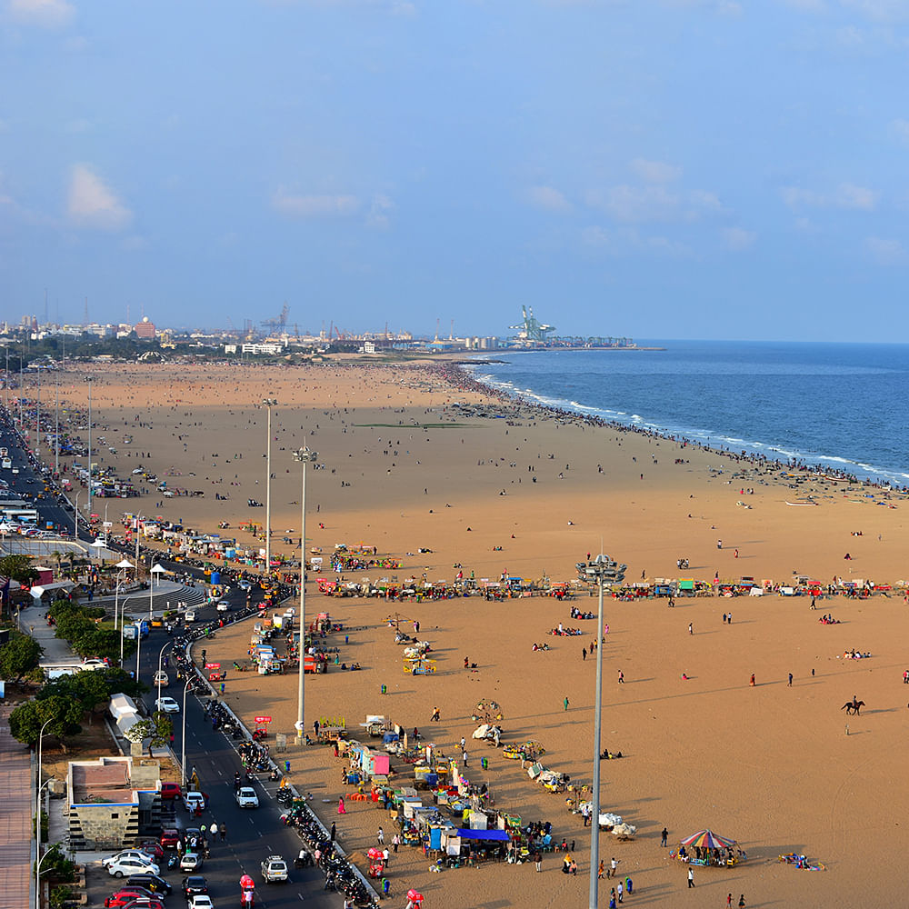 Water,Sky,Cloud,Natural environment,People on beach,Beach,Coastal and oceanic landforms,Landscape,Horizon,Travel