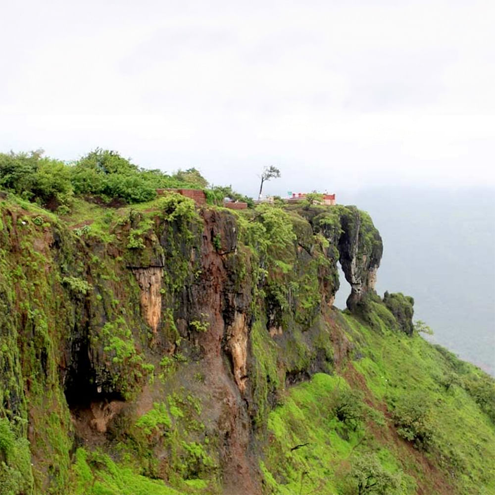 Sky,Plant community,Plant,Mountain,Bedrock,Natural landscape,Cloud,Terrain,Landscape,Grass