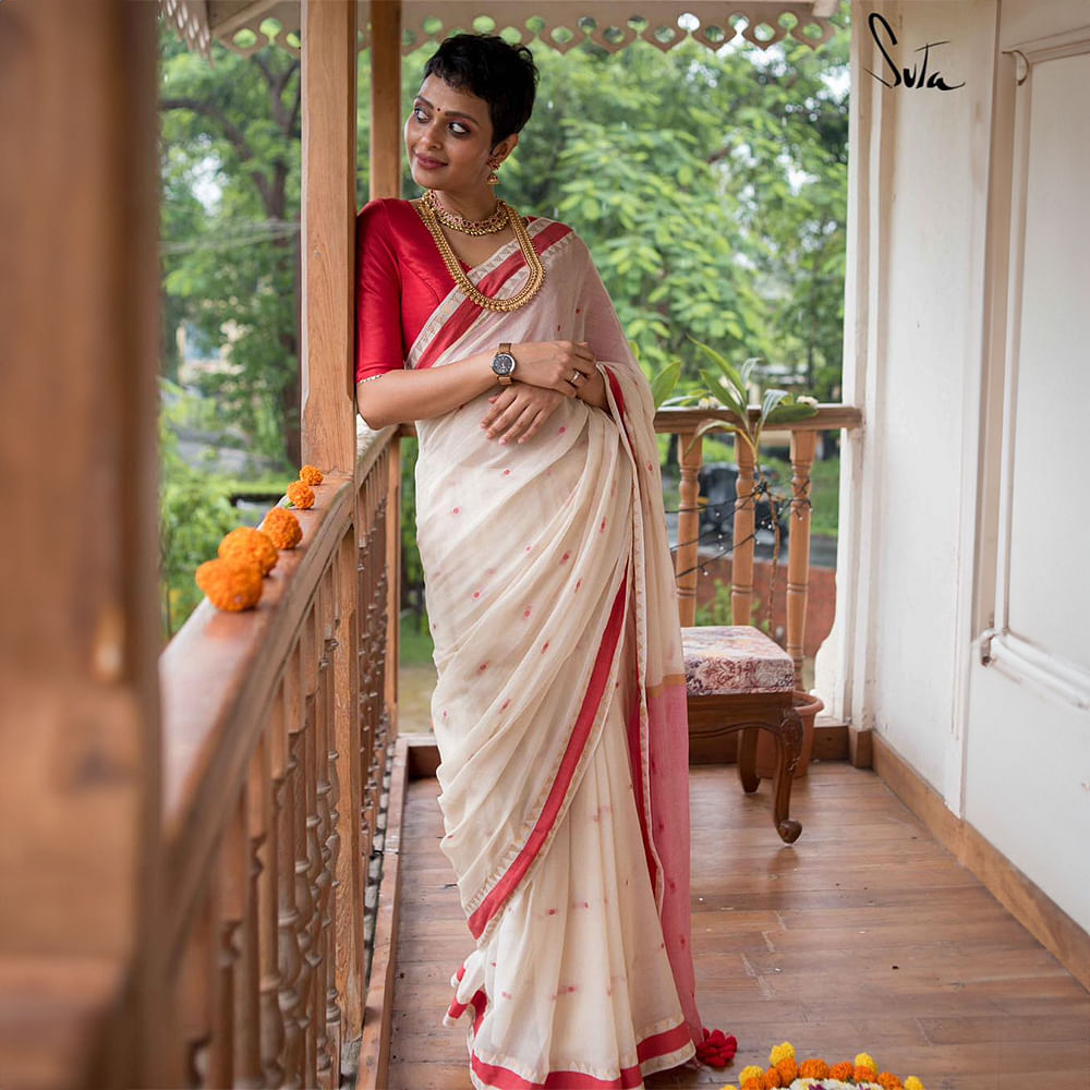 Shoulder,Sari,Temple,Leisure,Formal wear,Fashion design,Event,Wood,Peach,Flooring