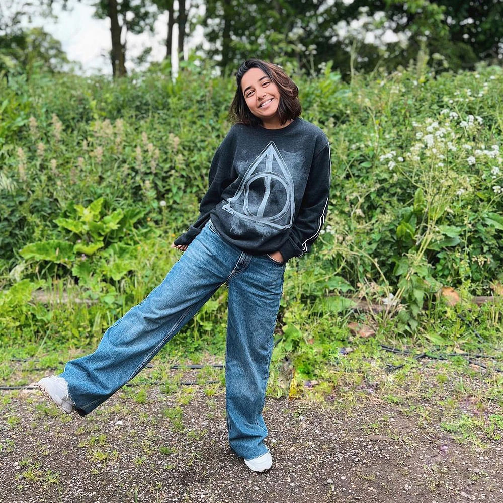 Jeans,Shoe,Plant,People in nature,Sleeve,Grass,Tree,Happy,Denim,Leisure