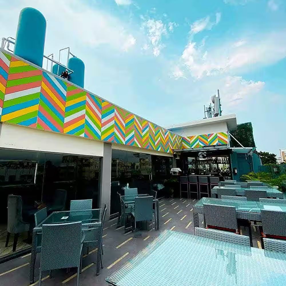 Cloud,Sky,Table,Furniture,Building,Shade,Outdoor furniture,Leisure,Outdoor table,Real estate