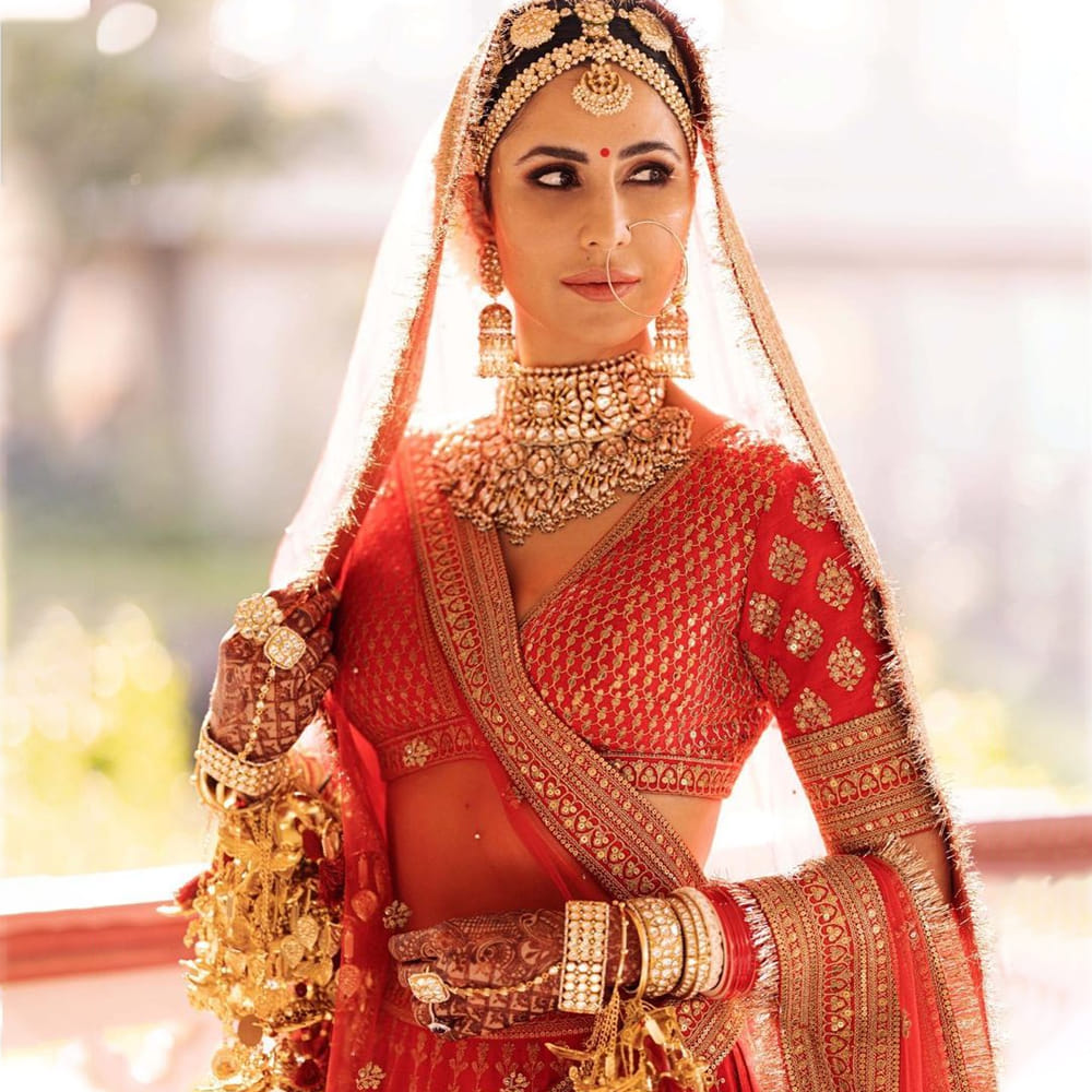 red bollywood dress Bollywood Hottie Mouni Roy Looks Breathtaking in Shimmery Red Dress ALBINA DYLA