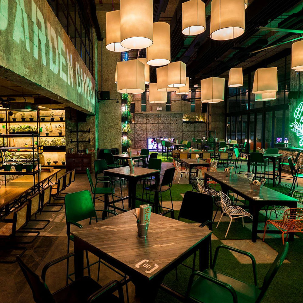 Table,Furniture,Building,Green,Light,Shelf,Chair,Lighting,Interior design,Drinking establishment