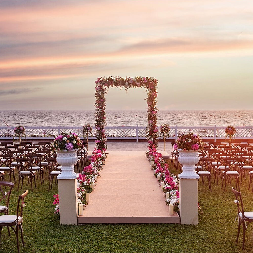 Sky,Cloud,Flower,Water,Decoration,Body of water,Chair,Plant,Horizon,Landscape