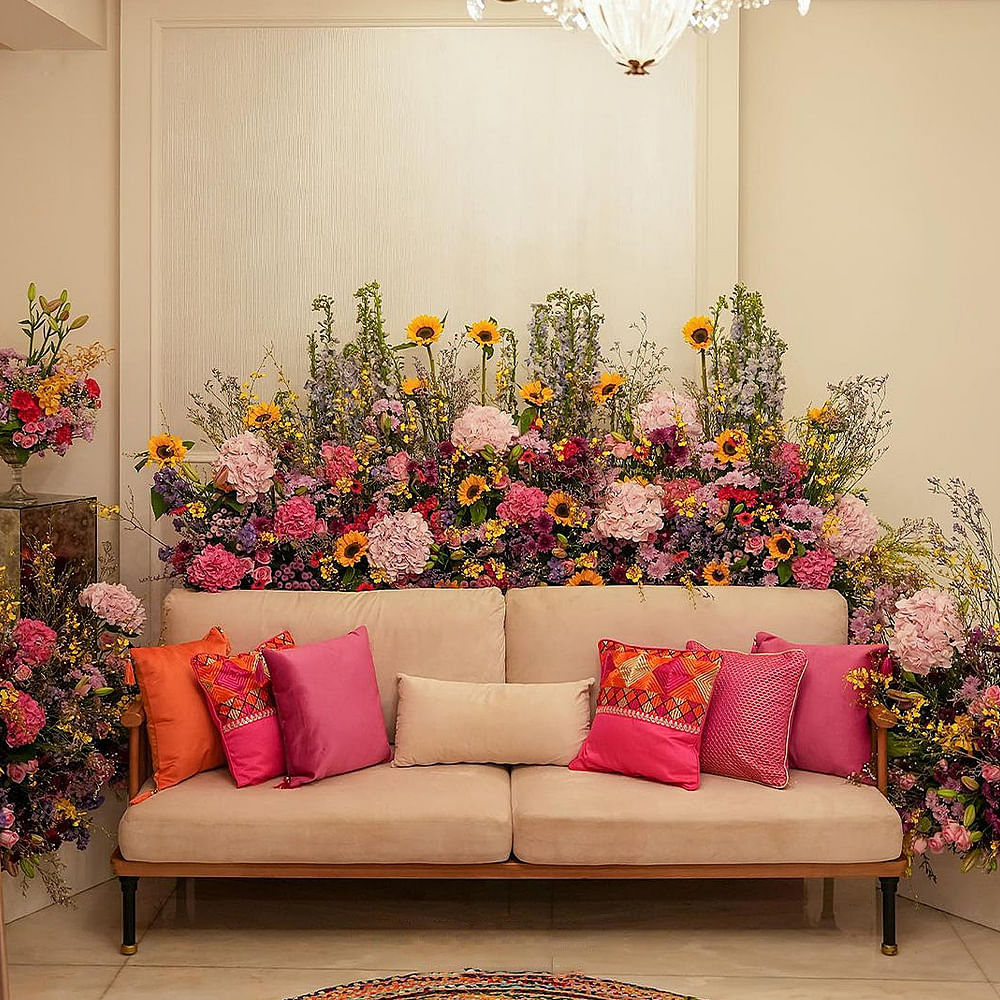 Flower,Plant,Furniture,Property,Rectangle,Decoration,Lighting,Interior design,Orange,Couch