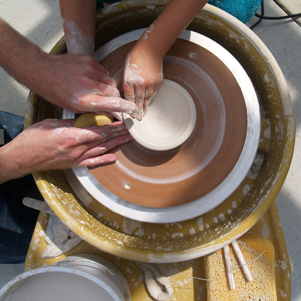 Hand,Potter's wheel,Wood,Artisan,Wheel,Cuisine,Automotive tire,Ingredient,Automotive wheel system,Clay