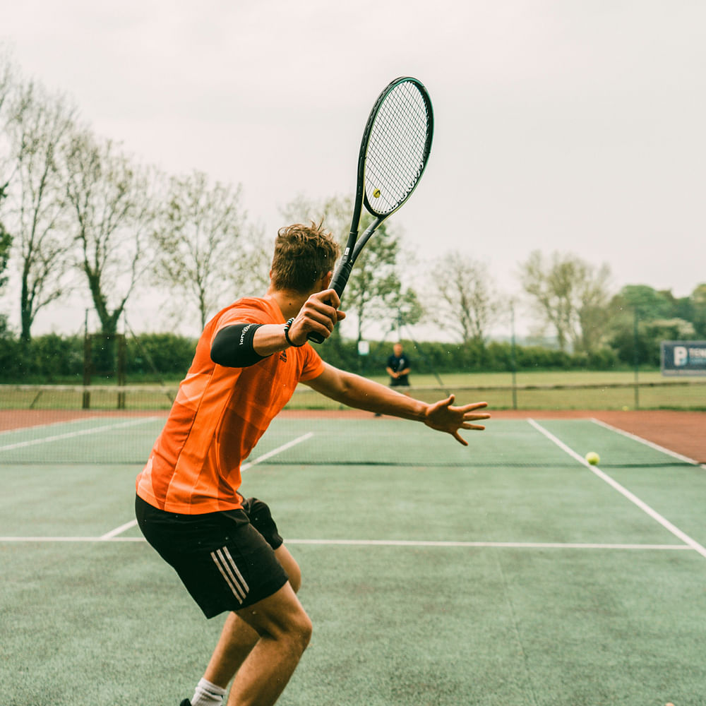 Hair,Face,Head,Playing sports,Tennis,Tennis racket,Sports equipment,Strings,Racketlon,Tennis Equipment