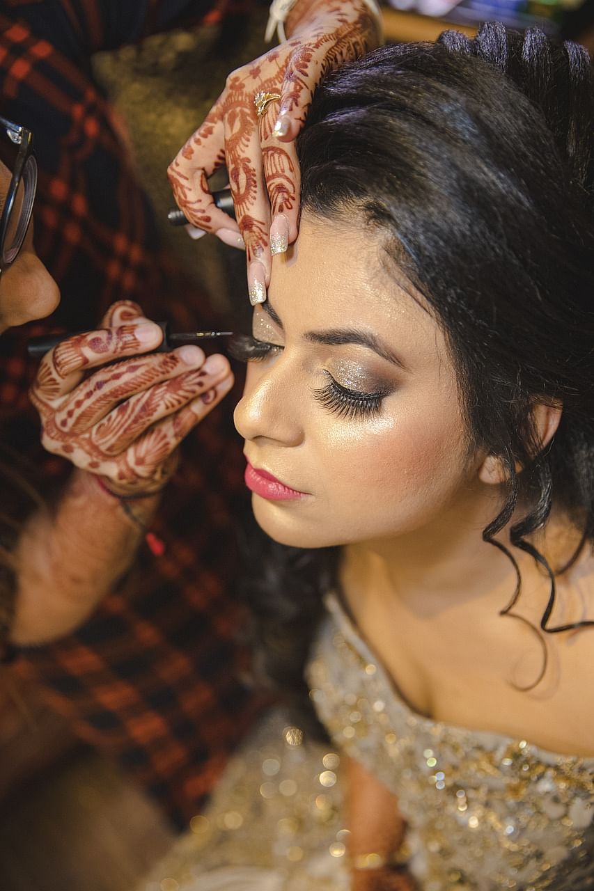 Skin,Lip,Hand,Eyebrow,Lipstick,Eyelash,Makeover,Flash photography,Dress,Gesture