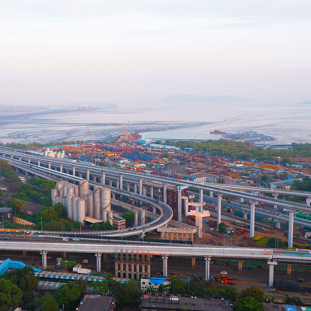 Building,Sky,Water resources,Cloud,Infrastructure,Tower block,Urban design,Water,Cityscape,Dusk