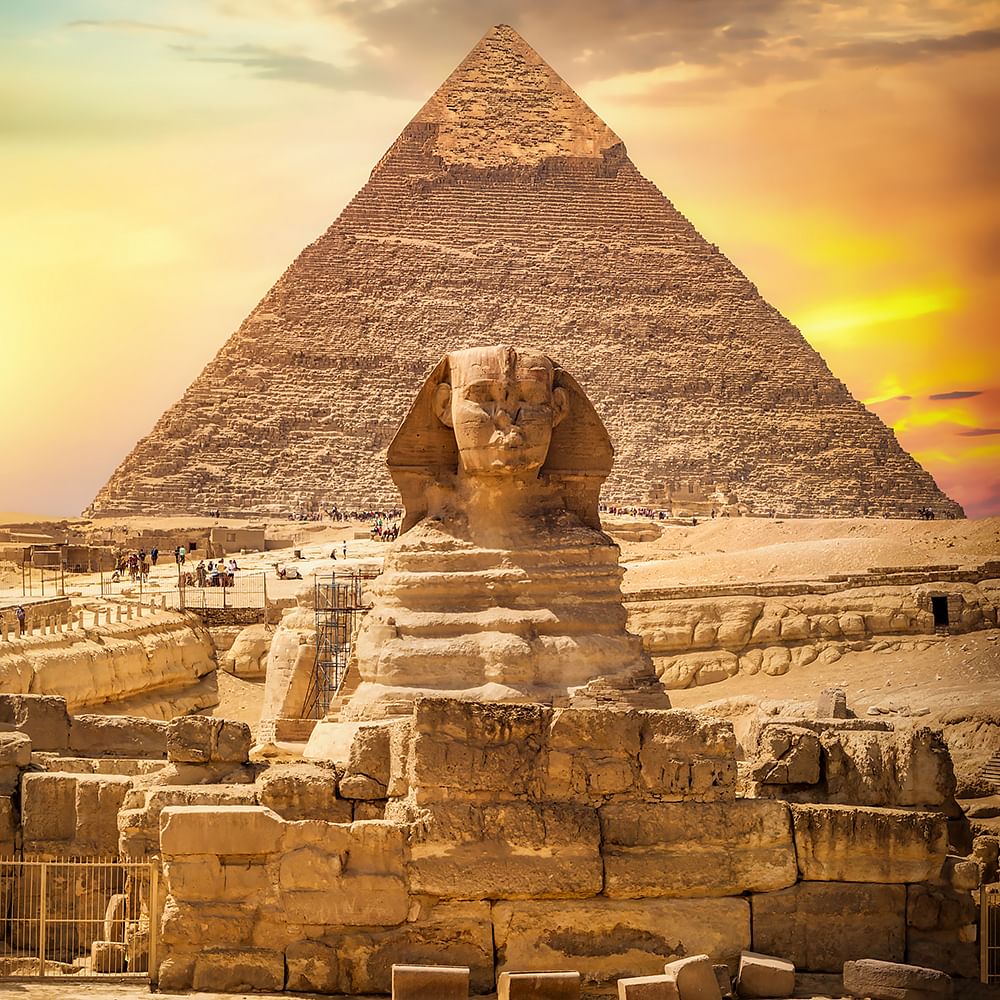 Cloud,Sky,Nature,Natural environment,Temple,Monument,Wonders of the world,Art,Archaeological site,Symmetry