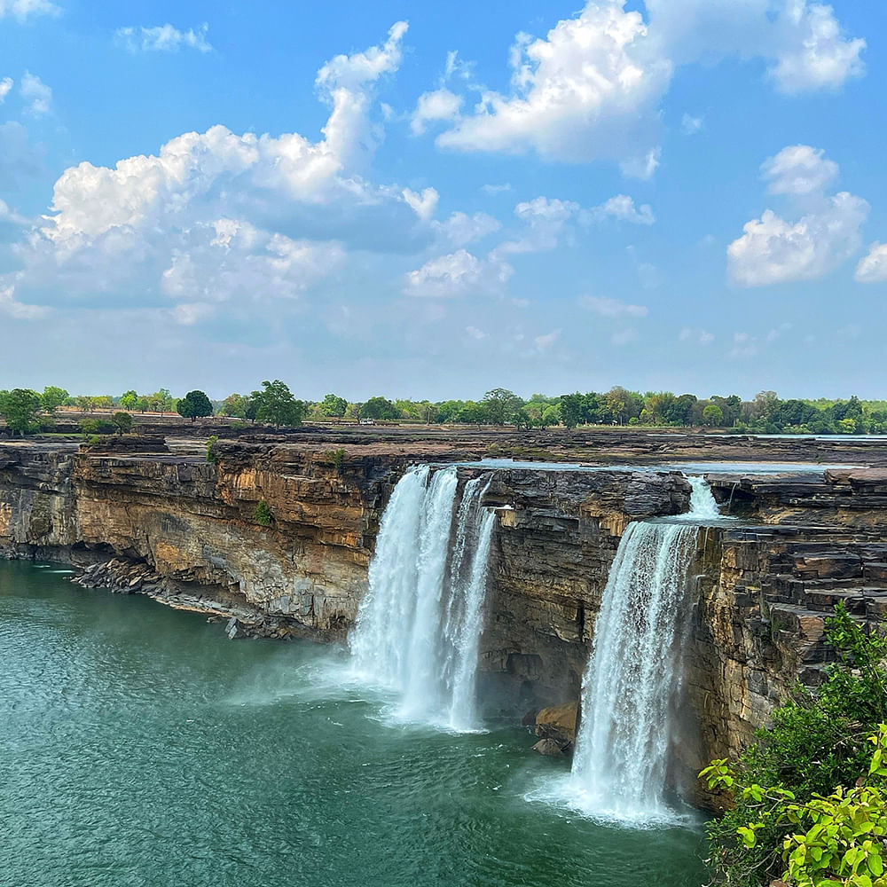 Water,Cloud,Sky,Water resources,Plant,Natural landscape,Fluvial landforms of streams,Waterfall,Watercourse,Chute