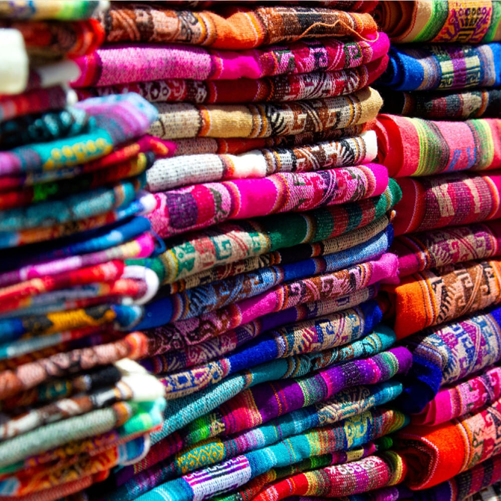 Red,Textile,Pink,Market,Retail,Purple,Creative arts,Woven fabric,Weaving,Bazaar