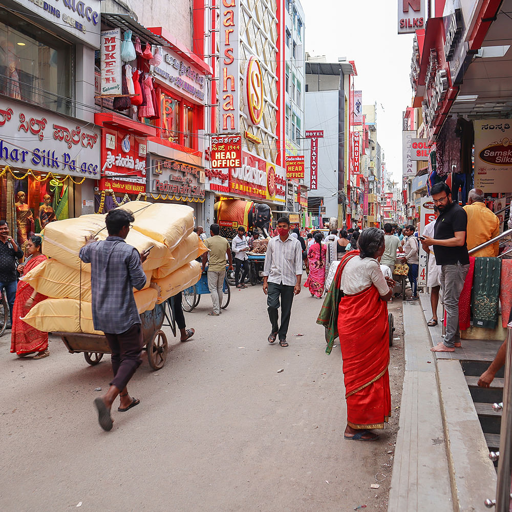 Footwear,Wheel,Tire,Infrastructure,Building,Temple,Vehicle,Market,Travel,Thoroughfare