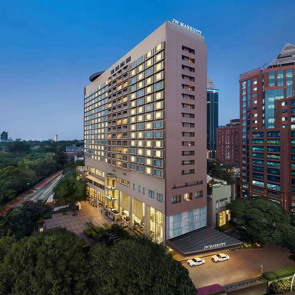 Sky,Building,Skyscraper,Property,Window,Plant,Tree,Tower block,Urban design,Neighbourhood