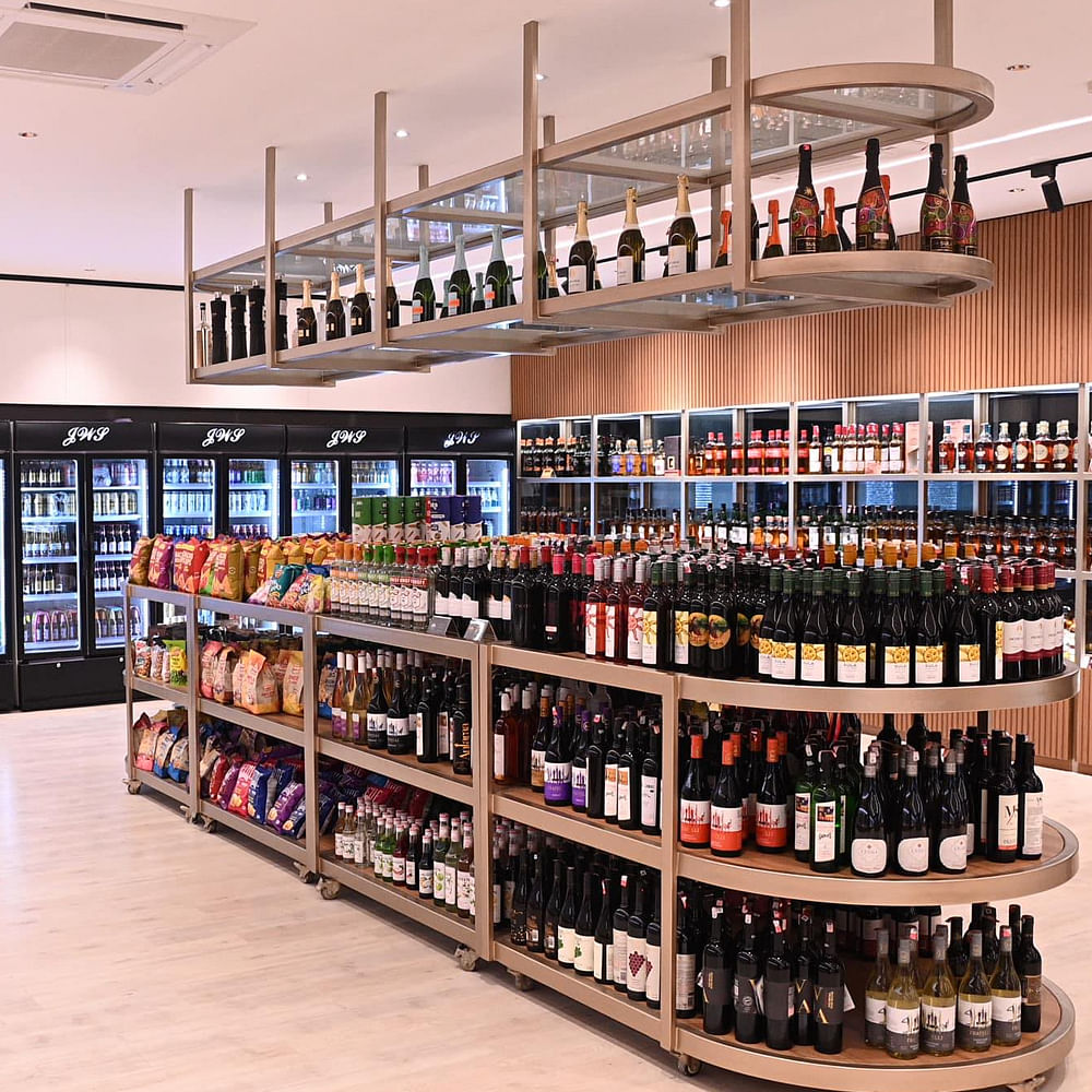 Bottle,Shelf,Shelving,Wine,Drinking establishment,Drinkware,Glass bottle,Barware,Alcoholic beverage,Drink