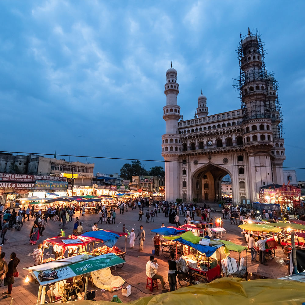 Sky,Cloud,Building,Travel,Tent,Leisure,City,People on beach,Urban area,Market