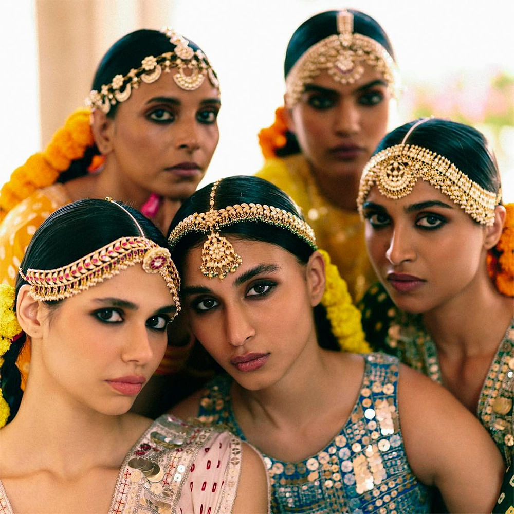 Face,Organ,Fashion,Temple,Yellow,Eyelash,Headgear,Community,Social group,Happy