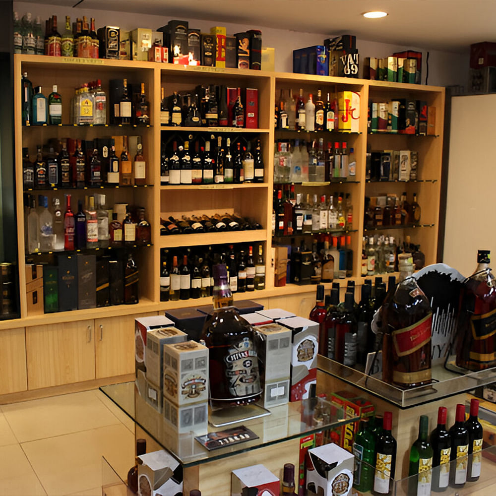 Bottle,Building,Shelf,Drinking establishment,Shelving,Glass bottle,Drink,Barware,Alcoholic beverage,Retail