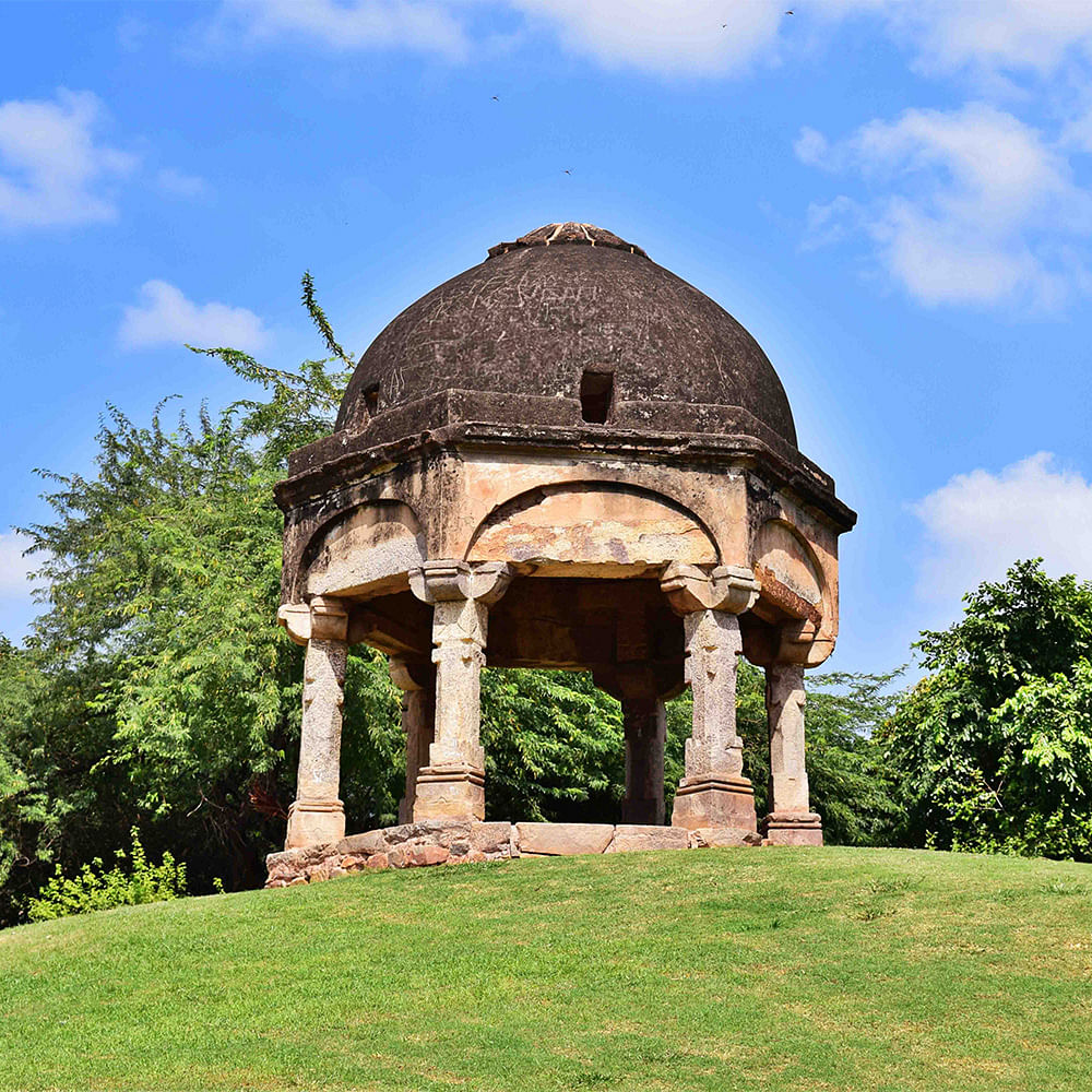 Sky,Cloud,Grass,Building,Plant,Tree,Dome,Natural landscape,Monument,Art