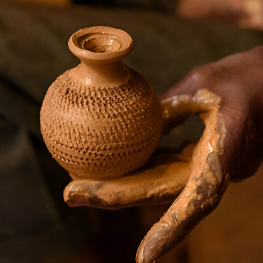 Pottery,Clay,Stoneware,Ceramic,Artifact,Craft,Creative arts,Artisan,Potter's wheel,Vase