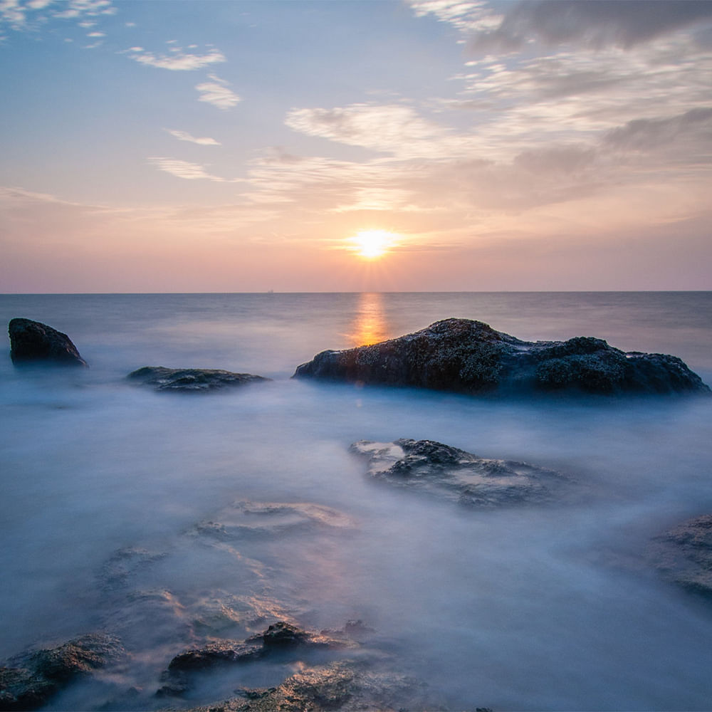 Sky,Blue,Water,Rock,Horizon,Body of water,Sunset,Afterglow,Dusk,Sea