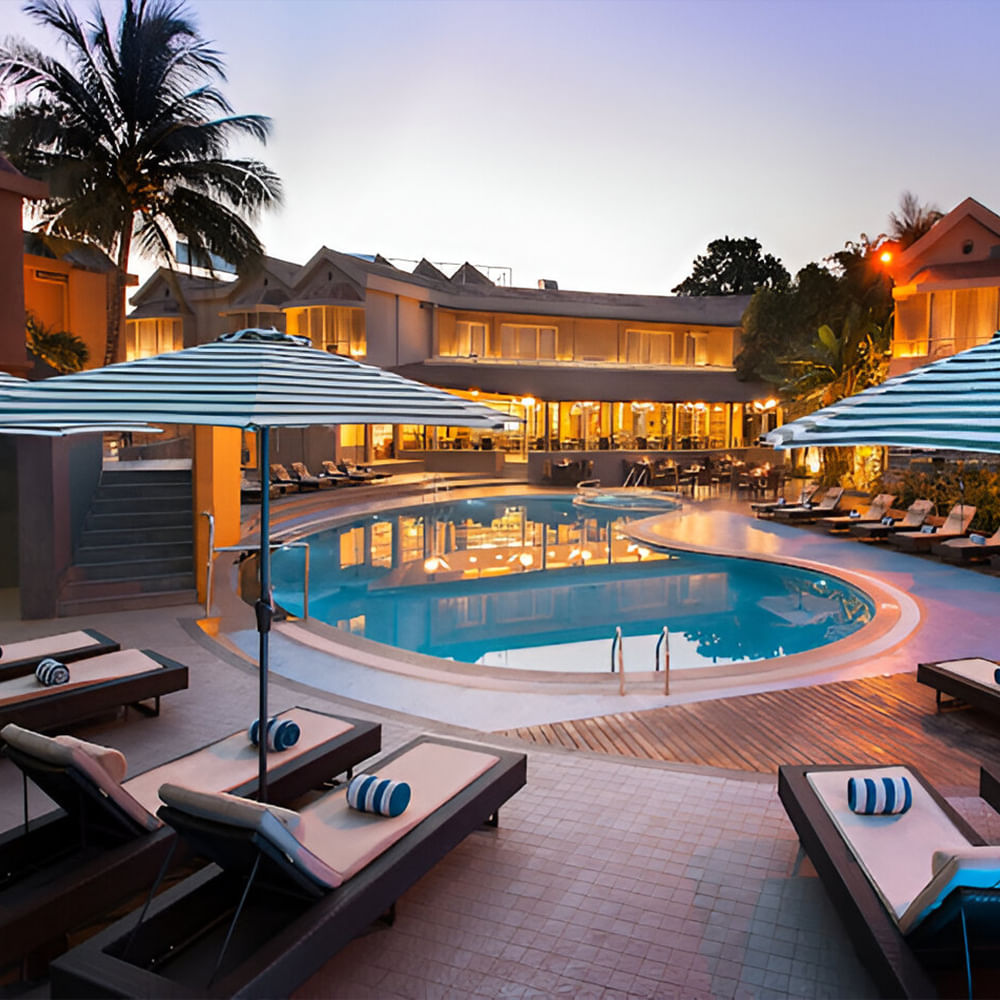 Swimming pool,Resort,Outdoor furniture,Leisure,Eco hotel,Sunlounger,Umbrella,Hotel,Vacation,Resort town