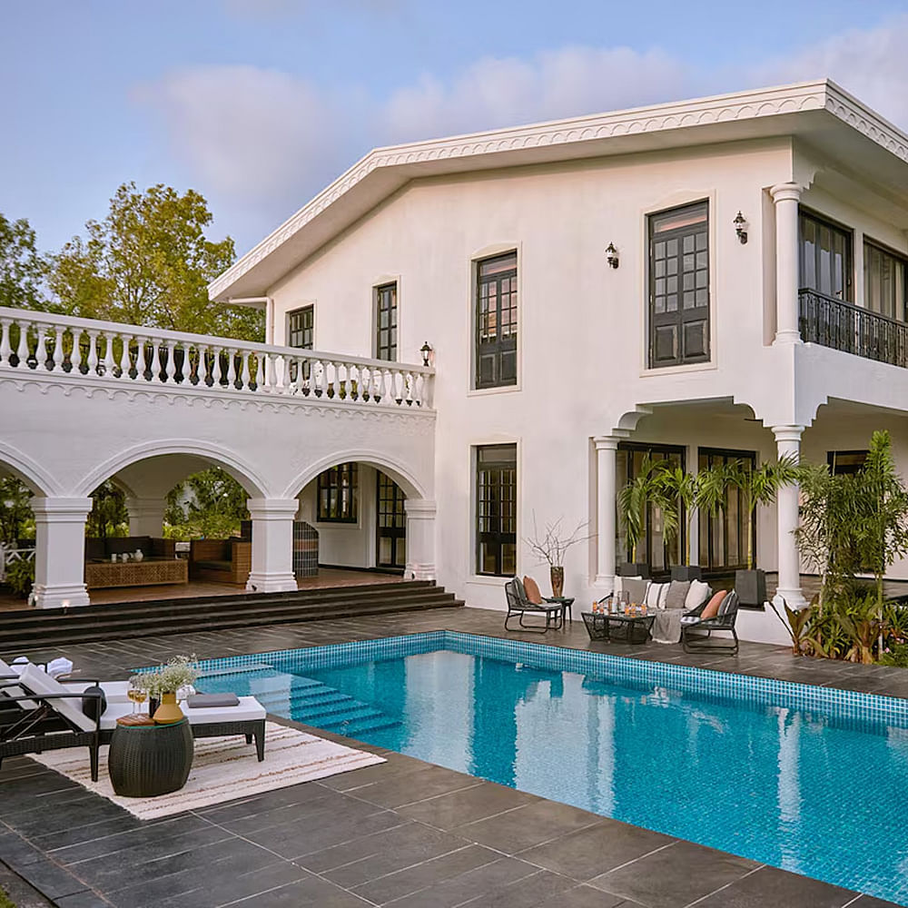 Swimming pool,Residential area,Home,Resort,Estate,Door,Porch,Mansion,Outdoor furniture,Villa