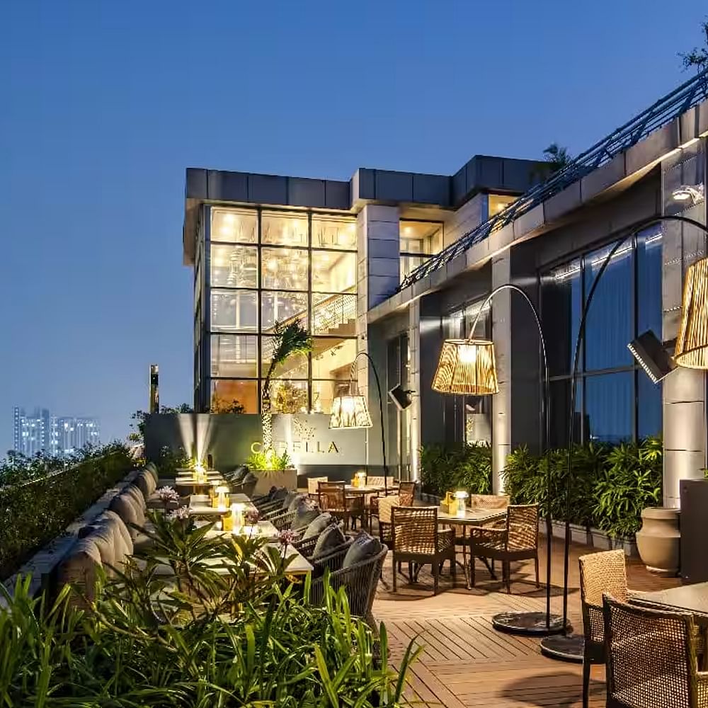 Urban design,Apartment,Condominium,Chair,Balcony,Resort,Restaurant,Eco hotel,High-rise building,Shade