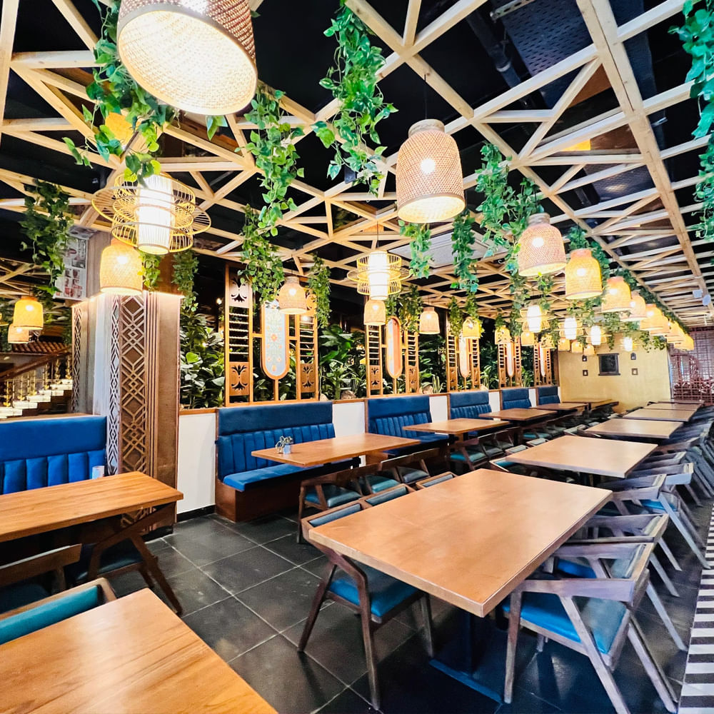 Interior design,Restaurant,Ceiling,Light fixture,Design,Chair,Chandelier,Cafeteria,Houseplant,Bar