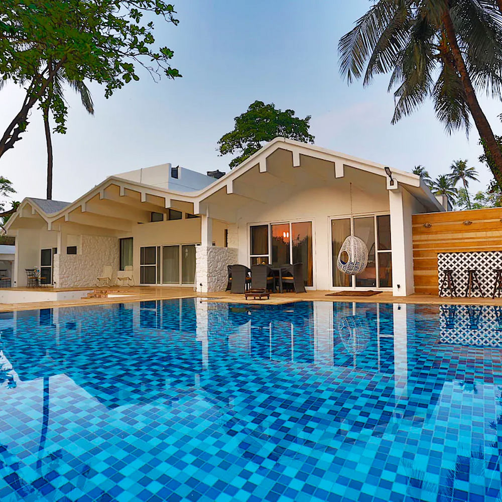Swimming pool,Resort,Shade,Hotel,Eco hotel,Estate,Villa,Palm trees,Resort town,Thermae