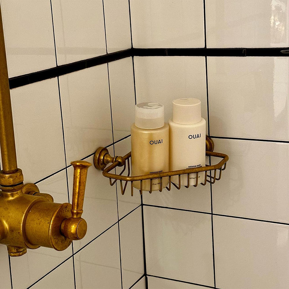 Personal care,Bathroom,Plumbing fixture,Plumbing,Tile,Household hardware,Tap,Soap dispenser,Brass,Still life photography