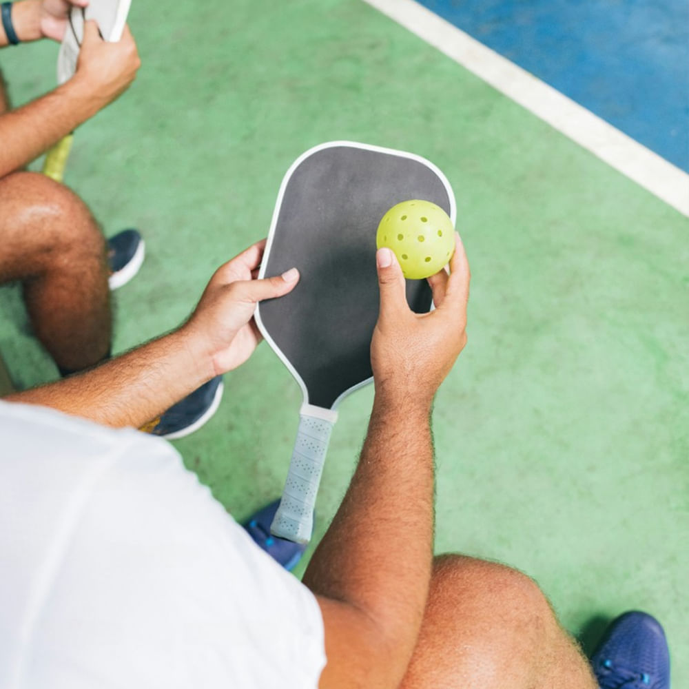 Ball game,Sports equipment,Sports,Ball,Racquet sport,Playing sports,Wrist,Game,Individual sport,Pickleball