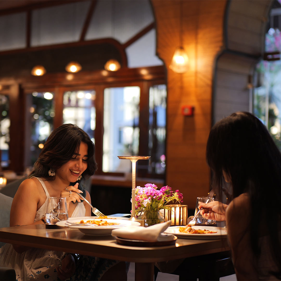 Furniture,Lighting,Table,Restaurant,Customer,Chair,Happiness,Light fixture,Dishware,Plate