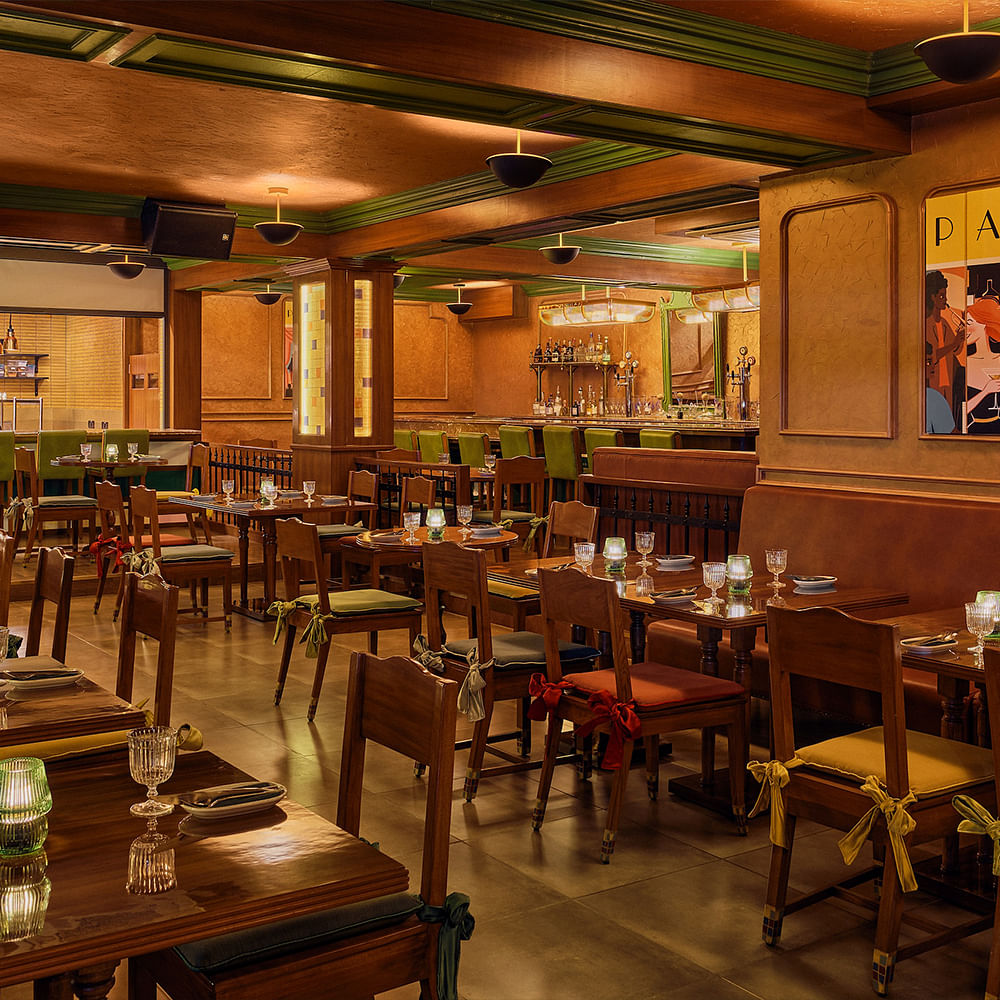 Furniture,Wood,Interior design,Table,Flooring,Restaurant,Ceiling,Chair,Barware,Wood stain