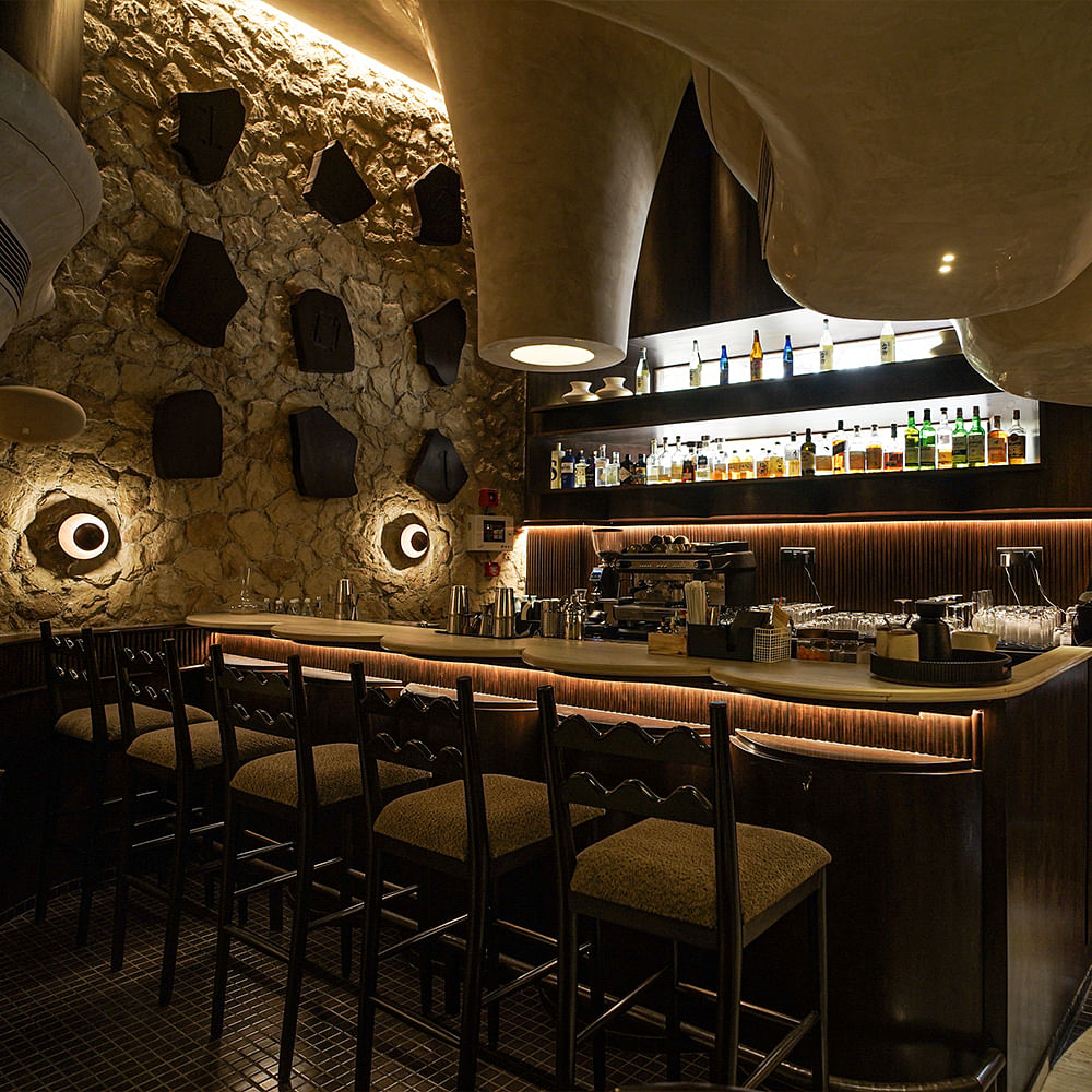 Lighting,Interior design,Light fixture,Restaurant,Bar,Chair,Pub,Barware,Drinking establishment,Countertop