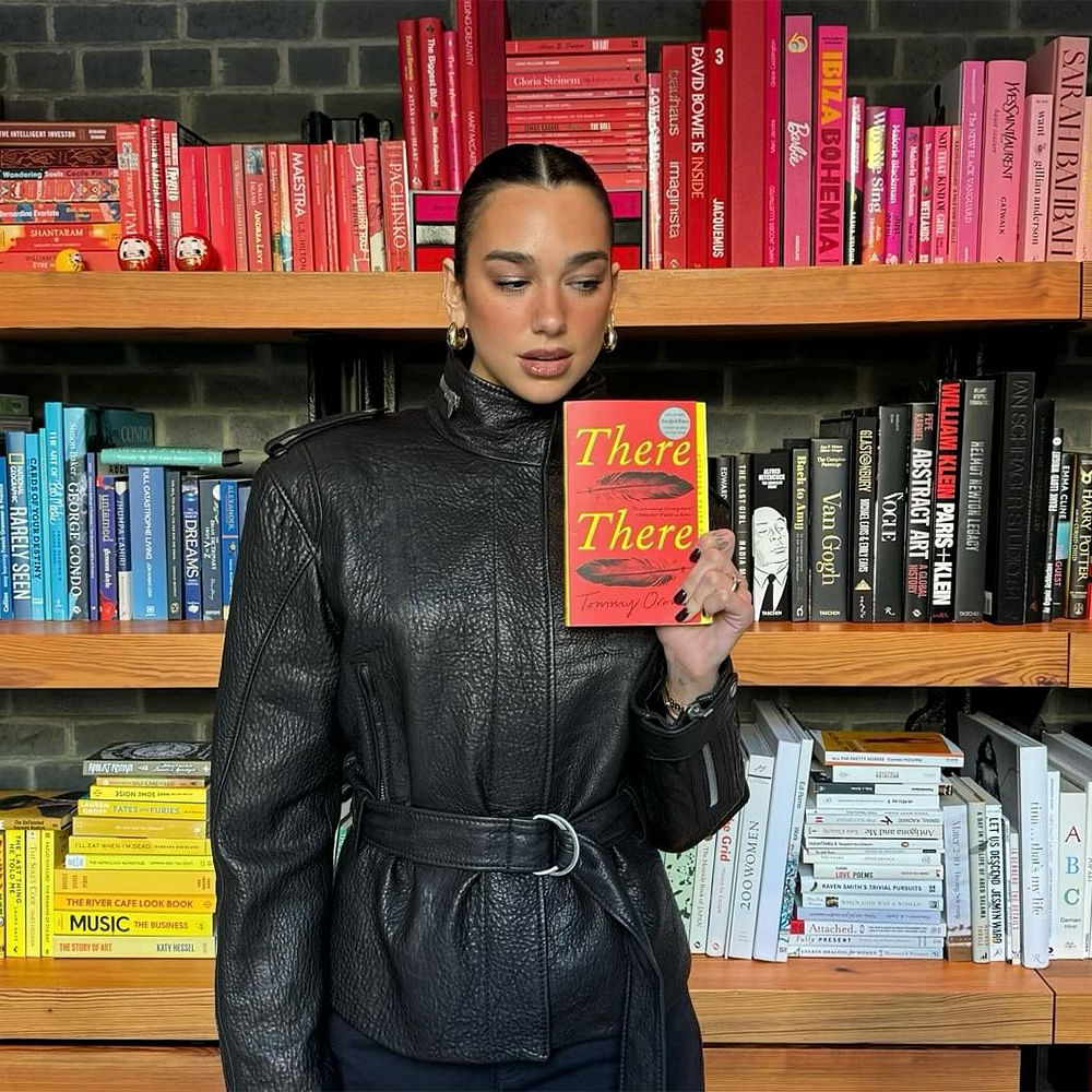 Leather jacket,Publication,Book,Shelf,Book cover,Cosmetics,Makeover,Shelving,Leather,Model