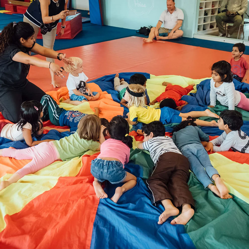 Leisure,Recreation,Child,Fun,Sleeping pad,Physical fitness,Kindergarten,Play,Lap,Toddler