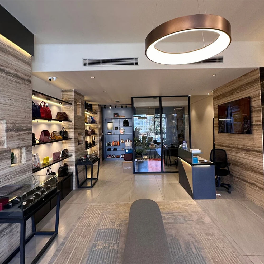 Interior design,Flooring,Ceiling,Floor,Lighting,Retail,Shelf,Light fixture,Glass,Shelving