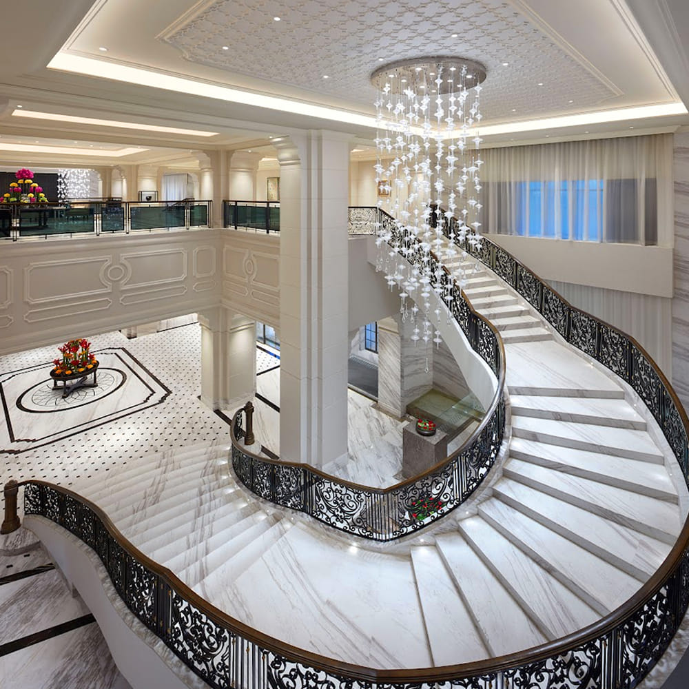 Interior design,Flooring,Stairs,Floor,Ceiling,Architecture,Lobby,Light fixture,Column,Molding