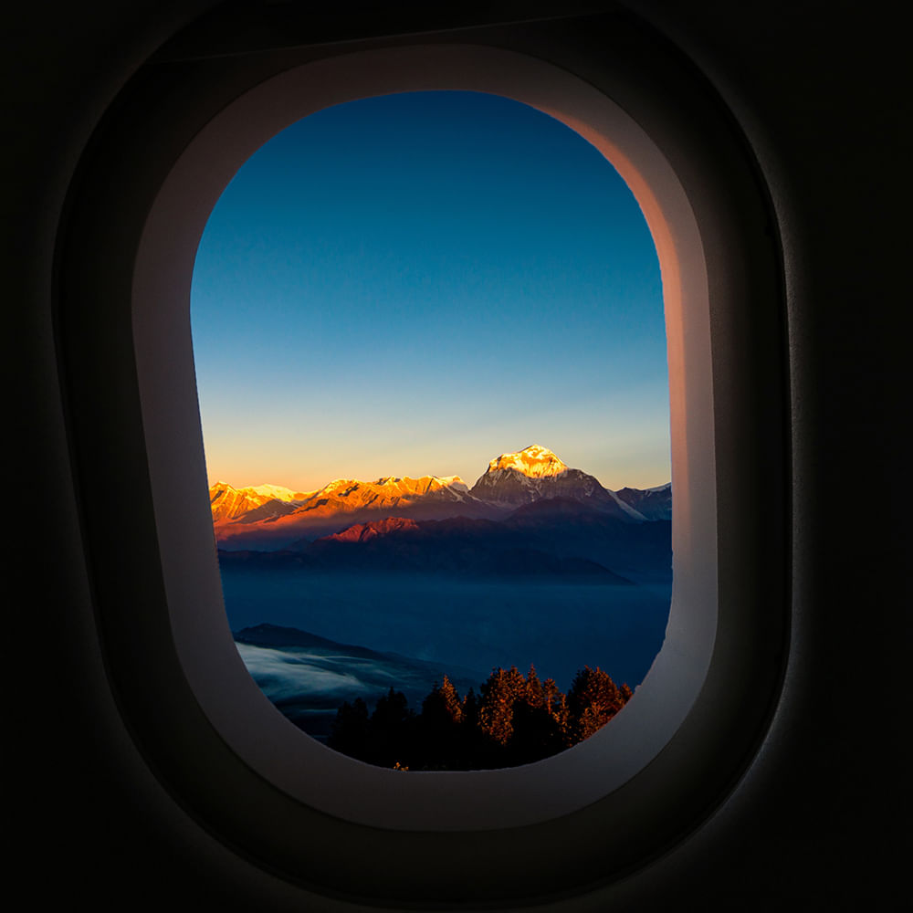 Air travel,Mountain range,Sunlight,Dusk,Sunrise,Evening,Ridge,Sunset,Heat,Flight