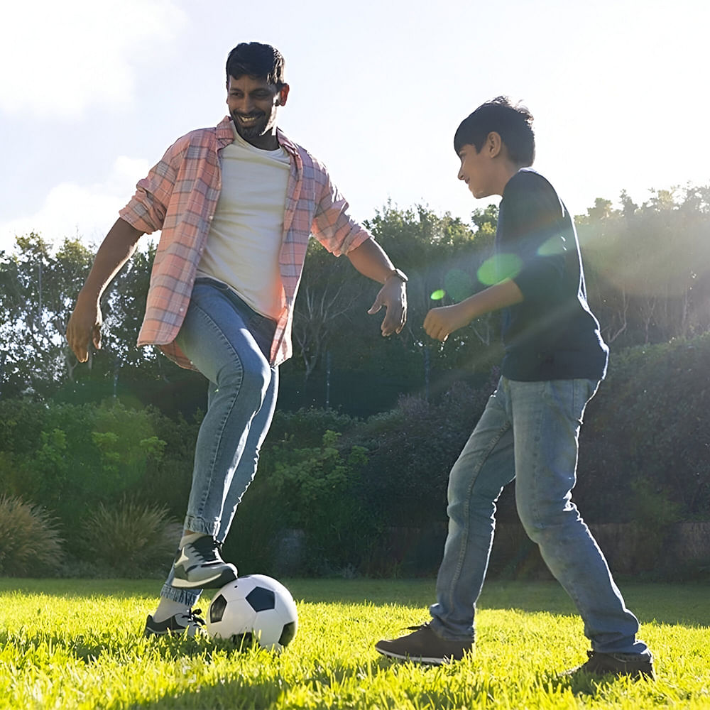 Football,Ball,Football,Soccer ball,Shorts,Ball game,Playing sports,Sports equipment,Recreation,Fun