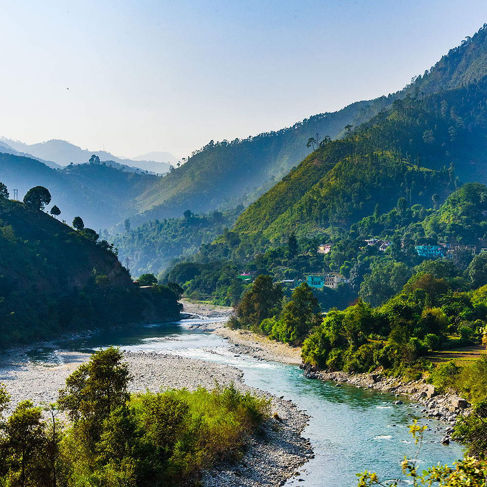 Mountainous landforms,Water,Mountain,Body of water,Nature,Hill,Natural landscape,Watercourse,Vegetation,Highland