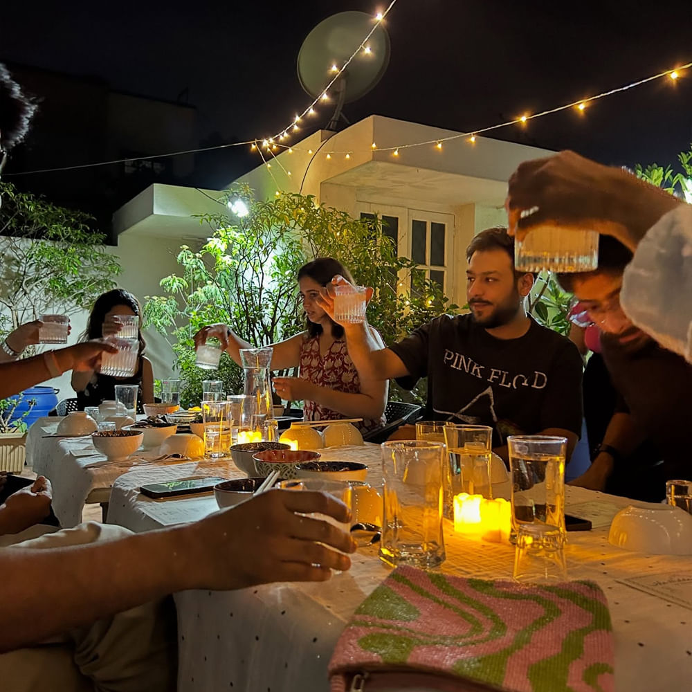 Furniture,Drinkware,Tableware,Shirt,Table,Lighting,Chair,Restaurant,Party,Food