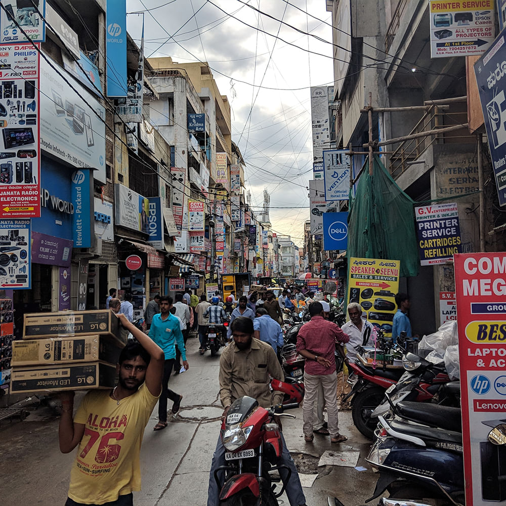 People,Mode of transport,Motorcycle,Urban area,City,Street,Town,Scooter,Neighbourhood,Pedestrian